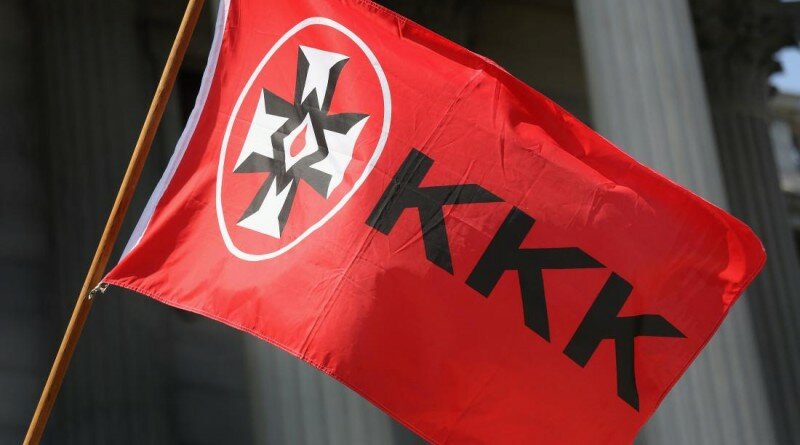 COLUMBIA, SC - JULY 18: A Ku Klux Klan flies during a Klan demonstration at the state house building on July 18, 2015 in Columbia, South Carolina. The KKK protested the removal of the Confederate flag from the state house grounds, as law enforcement tried to prevent violence between the opposing groups. (Photo by John Moore/Getty Images)